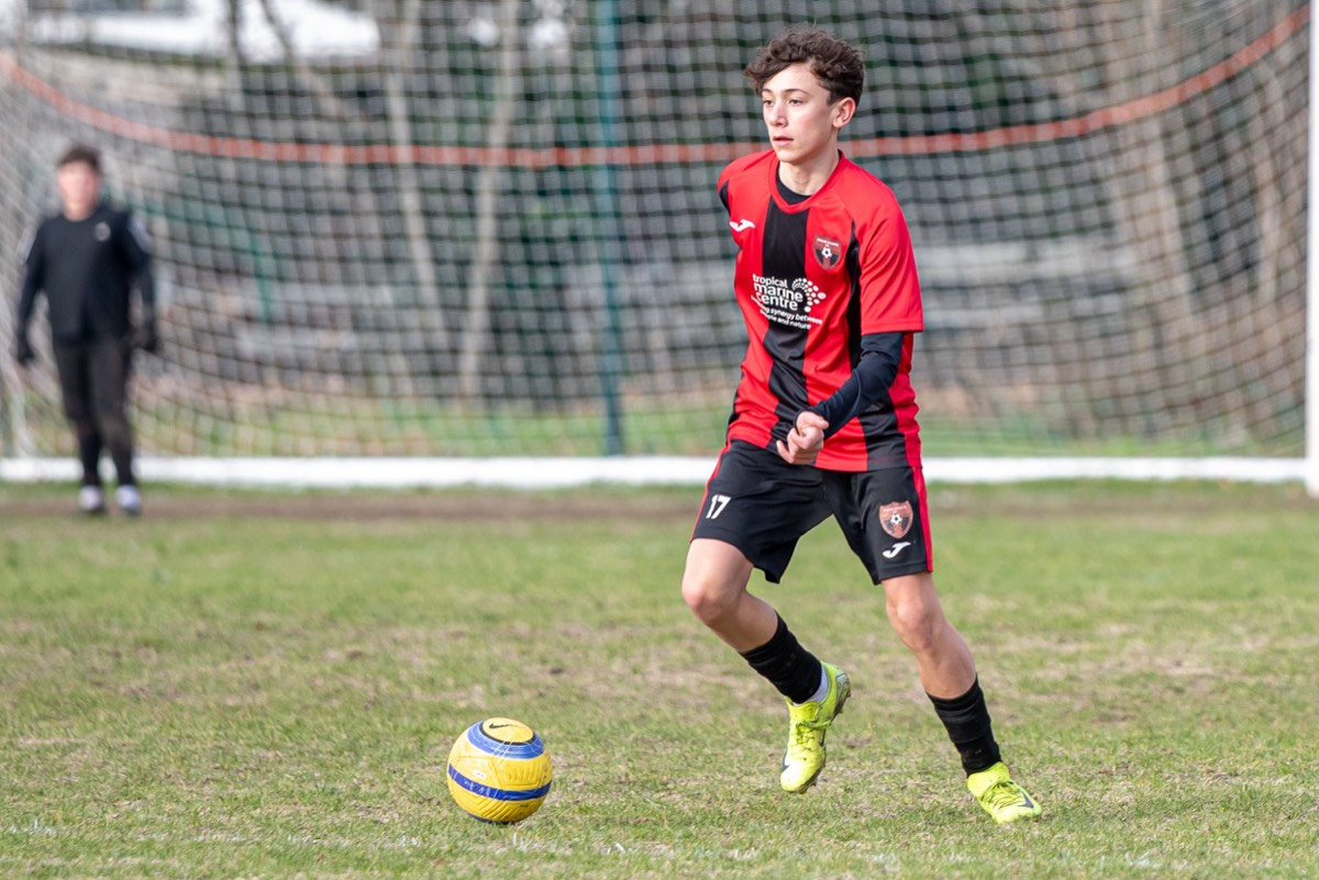 Lions defender clearing the ball in the Chipstead fixture