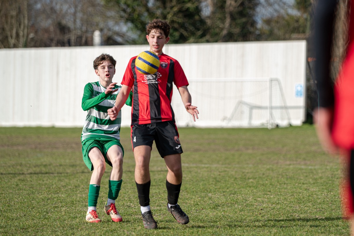 Lions striker shooting during the Chipstead league match