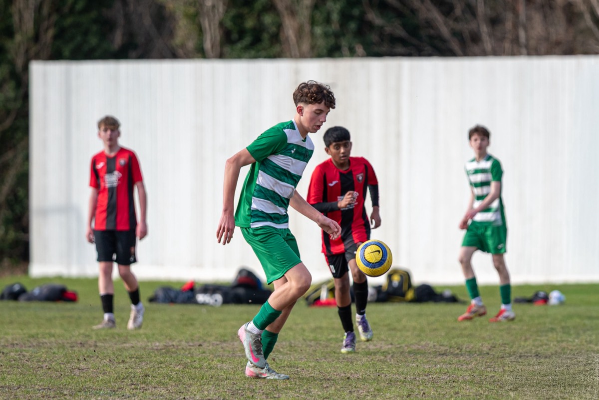 Lions player competing for a loose ball with Chipstead