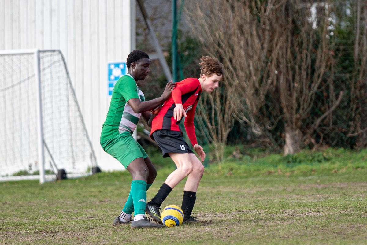 Lions substitute warming up on the sideline at Peaches Close